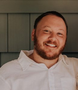 A photo of a smiling white man